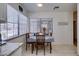 Bright kitchen nook with tile floors, table with chairs and a view out the window at 368 Umbria Way, Henderson, NV 89014
