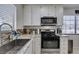 Bright kitchen with stainless steel appliances, granite countertops, and plenty of cabinet storage at 368 Umbria Way, Henderson, NV 89014