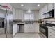 Modern kitchen featuring granite countertops, stainless steel appliances, and bright natural light at 368 Umbria Way, Henderson, NV 89014