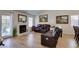Spacious living room with fireplace, hardwood floors, and lots of natural light at 368 Umbria Way, Henderson, NV 89014