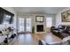 Bright living room features hardwood floors, fireplace, and large french doors at 368 Umbria Way, Henderson, NV 89014