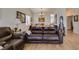 Bright living room featuring hardwood floors, a neutral color scheme, and comfortable seating at 368 Umbria Way, Henderson, NV 89014