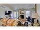 Cozy living room featuring a fireplace and access to the backyard patio at 368 Umbria Way, Henderson, NV 89014