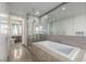 Luxury bathroom featuring a soaking tub, glass shower, and modern fixtures at 3722 Las Vegas Blvd # 2509, Las Vegas, NV 89158