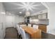 Modern open concept kitchen with a dining area featuring a large wooden table with chairs at 3722 Las Vegas Blvd # 2509, Las Vegas, NV 89158