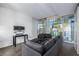 Modern living room with comfortable gray couches and floor-to-ceiling windows at 3722 Las Vegas Blvd # 2509, Las Vegas, NV 89158