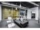 Contemporary living room featuring a comfortable sofa, accent tables, and floor-to-ceiling windows showcasing city views at 3722 Las Vegas Blvd # 2509, Las Vegas, NV 89158
