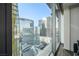 Enjoy the amazing city views from this living room, showcasing modern high-rise buildings at 3722 Las Vegas Blvd # 2509, Las Vegas, NV 89158