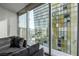 Bright living room with amazing city views from the expansive floor-to-ceiling windows at 3722 Las Vegas Blvd # 2509, Las Vegas, NV 89158
