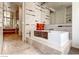 Modern bathroom featuring a soaking tub with marble tile, walk-in shower, and vanity with wood cabinets at 3726 Las Vegas Blvd # 3202, Las Vegas, NV 89158