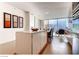 Modern kitchen with white cabinetry, a center island, and city views from the adjacent living area at 3726 Las Vegas Blvd # 3202, Las Vegas, NV 89158