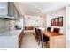 Bright, modern kitchen with stainless steel appliances, sleek cabinetry and a island with dining at 3726 Las Vegas Blvd # 3202, Las Vegas, NV 89158