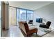 Modern living room with city views, sleek furniture, and tiled floors at 3726 Las Vegas Blvd # 3202, Las Vegas, NV 89158