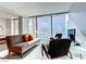Modern living room with city views, sleek furniture, and tiled floors at 3726 Las Vegas Blvd # 3202, Las Vegas, NV 89158