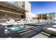 A rooftop pool and spa feature modern lounge seating and an outdoor dining area with views at 3726 Las Vegas Blvd # 3202, Las Vegas, NV 89158
