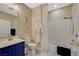 A well-appointed bathroom featuring a combined tub and shower, elegant decor and blue accents at 3728 Richard Allen Ct, Las Vegas, NV 89147