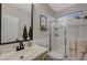 Bright bathroom features a glass-enclosed shower, modern sink, and neutral color palette at 3728 Richard Allen Ct, Las Vegas, NV 89147
