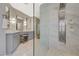 Modern bathroom featuring a glass shower with marble tile surround and vanity with double sinks at 3728 Richard Allen Ct, Las Vegas, NV 89147