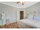 Cozy bedroom offers wood flooring, light blue accents, and a walk-in closet at 3728 Richard Allen Ct, Las Vegas, NV 89147