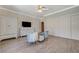 Bedroom with two chairs, dresser, TV, ceiling fan, wood floors, and closet with sliding doors at 3728 Richard Allen Ct, Las Vegas, NV 89147