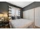 This cozy bedroom features sleek gray walls, a modern window, and ample closet space at 3728 Richard Allen Ct, Las Vegas, NV 89147