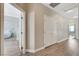 Bright hallway with wood flooring, closet, and doorways leading to different rooms at 3728 Richard Allen Ct, Las Vegas, NV 89147