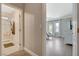 Hallway view of the ensuite bathroom and Primary bedroom with updated light fixtures at 3728 Richard Allen Ct, Las Vegas, NV 89147