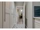 Bright hallway featuring decorative tile flooring, white cabinetry, and an inviting entrance to the main living area at 3728 Richard Allen Ct, Las Vegas, NV 89147