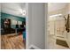 Hallway leading to a bathroom on the right and an office on the left at 3728 Richard Allen Ct, Las Vegas, NV 89147