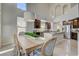 Open kitchen with a center island, modern appliances and a dining area at 3728 Richard Allen Ct, Las Vegas, NV 89147