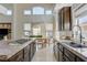 Bright kitchen featuring granite counters, stainless appliances, and a breakfast nook with elegant dining set at 3728 Richard Allen Ct, Las Vegas, NV 89147