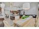 Bright open-concept kitchen features a granite island, stainless steel appliances, and dark wood cabinetry at 3728 Richard Allen Ct, Las Vegas, NV 89147