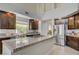 This kitchen features granite counters, stainless appliances, an island with cooktop and ample cabinet space at 3728 Richard Allen Ct, Las Vegas, NV 89147