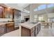 Bright and spacious kitchen leading to the dining area with stainless steel appliances and modern countertops at 3728 Richard Allen Ct, Las Vegas, NV 89147