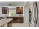 This kitchen features granite counters, stainless appliances, an island with cooktop and ample cabinet space at 3728 Richard Allen Ct, Las Vegas, NV 89147