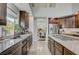 Modern kitchen featuring granite countertops, stainless appliances, and a view into the formal dining room at 3728 Richard Allen Ct, Las Vegas, NV 89147