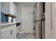 Well-organized laundry room with modern washer/dryer, ample counter space, and stylish tile flooring at 3728 Richard Allen Ct, Las Vegas, NV 89147