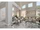 Bright and airy living room with high ceilings, elegant furnishings, and large windows at 3728 Richard Allen Ct, Las Vegas, NV 89147