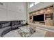 Inviting living room features high ceilings, a built-in media center, and modern furnishings at 3728 Richard Allen Ct, Las Vegas, NV 89147