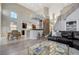 Open floor plan with modern kitchen, living room, and a staircase at 3728 Richard Allen Ct, Las Vegas, NV 89147