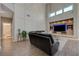 Cozy living room with high ceilings, a modern entertainment center, and comfortable seating at 3728 Richard Allen Ct, Las Vegas, NV 89147