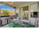 Outdoor kitchen and covered patio with dining table, perfect for entertaining at 3728 Richard Allen Ct, Las Vegas, NV 89147