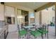Outdoor kitchen and covered patio with dining table, perfect for entertaining at 3728 Richard Allen Ct, Las Vegas, NV 89147