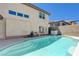 Backyard pool with tanning shelf, and patio with covered seating area at 3728 Richard Allen Ct, Las Vegas, NV 89147