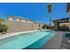 Inviting backyard pool with sunny blue sky and privacy wall at 3728 Richard Allen Ct, Las Vegas, NV 89147