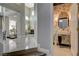 Unique powder room with butterfly wallpaper, floating sink, gold accents, and modern lighting at 3728 Richard Allen Ct, Las Vegas, NV 89147