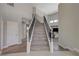 Elegant staircase with modern railing and wood steps, leading to the upper level at 3728 Richard Allen Ct, Las Vegas, NV 89147