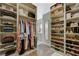 Well-organized walk-in closet with custom shelving, drawers, and ample storage for clothes and shoes at 3728 Richard Allen Ct, Las Vegas, NV 89147
