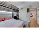 Bedroom featuring a bunk bed, closet, and carpet, offering plenty of room for relaxation and storage at 3928 Edgemoor Way, Las Vegas, NV 89121