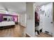 Well-organized closet with shelves and storage in a bedroom with a purple accent wall and modern seating at 3928 Edgemoor Way, Las Vegas, NV 89121